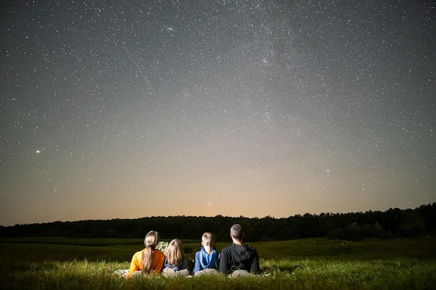 A group of people stargazing in a rural area at night, using telescopes and binoculars. The sky is clear and filled with stars, with minimal light pollution visible on the horizon.