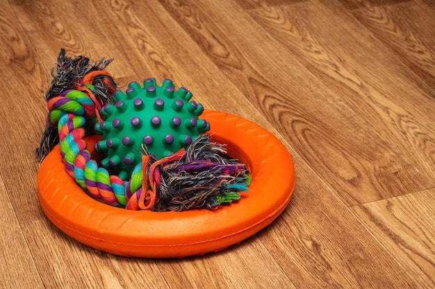 A side-by-side comparison image showing a subscription box with 5 various pet toys (ball, rope, plush) priced at $35, alongside individually purchased similar toys totaling $25. A small calculator icon is present to emphasize cost comparison.