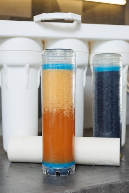 A close-up shot of a canister filter with its various filtration stages clearly visible, showcasing the different media used for mechanical, chemical, and biological filtration. Focus on the layered design and the flow of water through the filter.