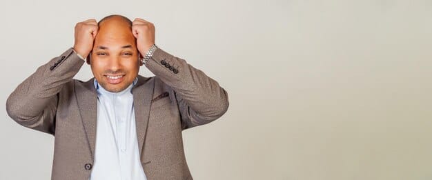 A close-up of a stressed person's hands gripping their head, symbolizing the mental burden of financial stress.