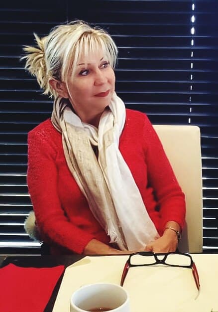 A split image showing a Baby Boomer in a traditional office setting on one side and a Millennial working remotely on a laptop in a coffee shop on the other, highlighting the contrasting work styles and career expectations.