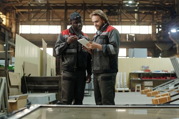An apprentice working alongside a seasoned professional in a manufacturing setting, both wearing safety gear and examining a piece of machinery. The environment is clean and organized, showcasing modern industrial technology.