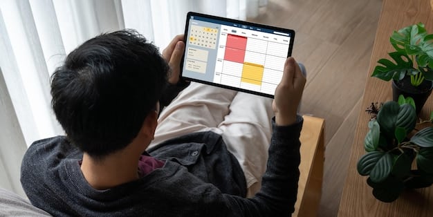 A person using a physical or digital planner to visually block time for different activities throughout the day. The planner should show a detailed schedule with clear time slots allocated for specific tasks, meetings, and breaks.