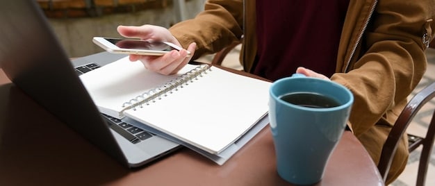 A person using a laptop to manage their finances and pay bills online, with a cup of coffee and a notepad nearby. The setting symbolizes convenience and control.