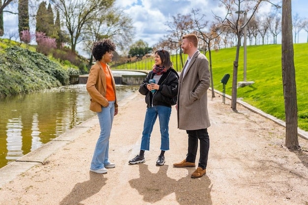 A mentor and mentee walking together in a park, engaged in a deep conversation, both looking thoughtful and reflective. The scene is set during a sunny afternoon.