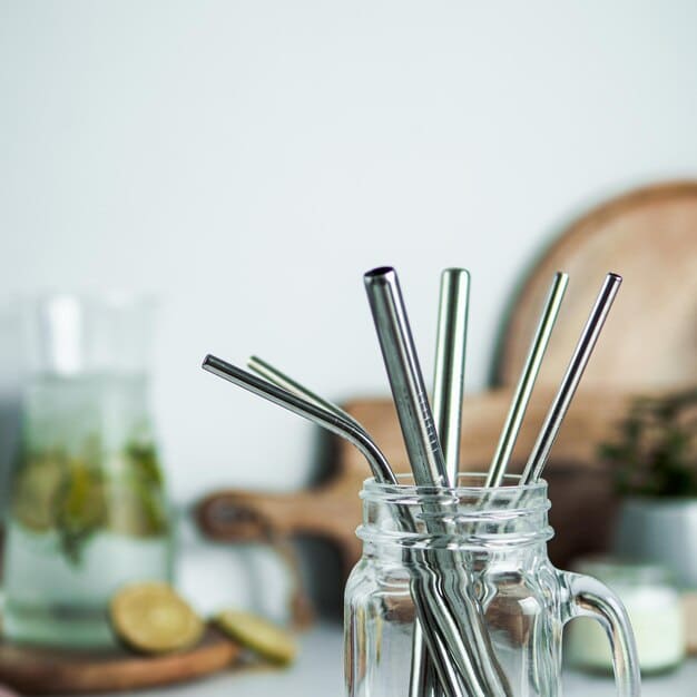 A visually appealing image showcasing a variety of sustainable drinking straw alternatives, such as stainless steel, bamboo, glass, and paper straws. The image emphasizes the eco-friendly nature and stylish design of these alternatives to plastic straws, highlighting solutions to the problem described as 