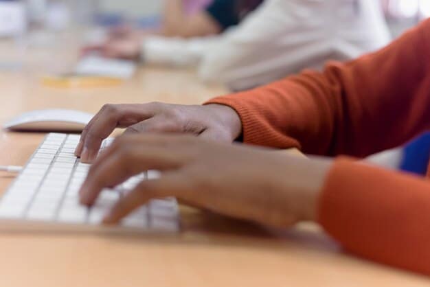 A close-up shot of a student's hands typing on a laptop keyboard, with the FAFSA application visible on the screen. The focus is on the simplicity of the form and the ease of navigation, highlighting Decoding the FAFSA: 7 Key Changes for the 2025-2026 Academic Year and How They Impact Your Aid.