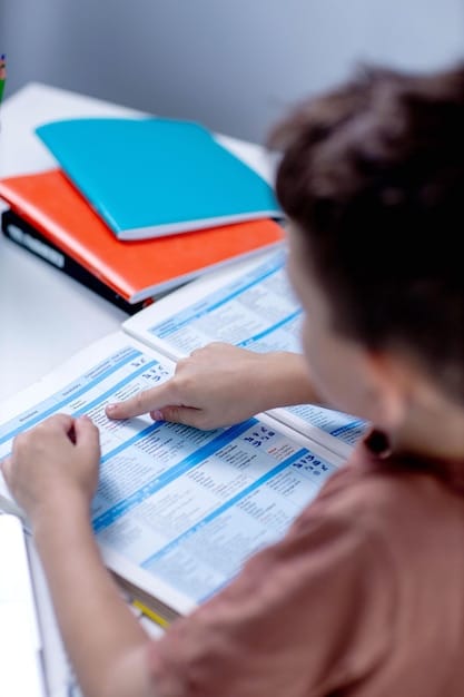 A close-up shot of a student meticulously filling out a college application form. The forms are on a wooden desk littered with pamphlets of various universities. A half-empty mug of coffee is nearby, and the background is softly blurred. The scene conveys the idea of deep consideration as the student fills out the 