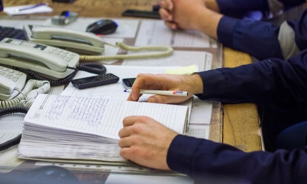 Close-up of customs declaration paperwork being reviewed by a customs officer. The paperwork has detailed information, stamps, and compliance checklists, signifying a thorough process. The scene highlights the importance of accurate documentation for how to leverage the updated US Customs Regulations for a 10% reduction in import duties in 2025.
