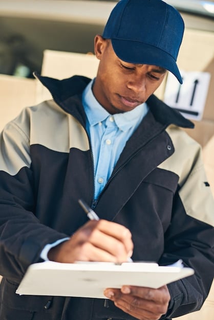 A close-up of a customs officer examining documents related to imported goods, set against a backdrop of stacked shipping containers. Focus on the precision and attention to detail required in customs inspections, illustrating a element of 