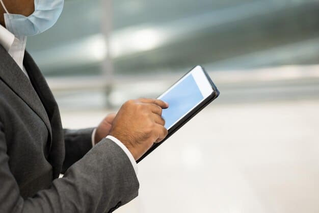 A close-up shot of a customs officer inspecting shipping documents with a tablet in hand. The background is slightly blurred, showing stacks of containers. This image represents the inspection process and the importance of accurate documentation for US Customs Clearance Procedures.