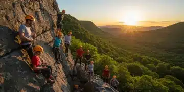 Diverse group rock climbing outdoors at sunset, embodying adventure and community