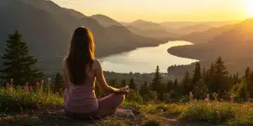 Woman meditating on mountain at sunrise, serene wellness retreat