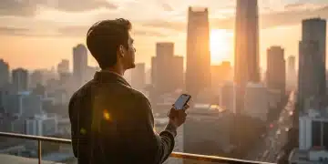 Mindful Technology Use: 4 Strategies for Americans to Reduce Screen Time in 2026 Sunrise over city, person holding phone mindfully, symbolizing balanced technology use.